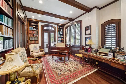 a living room with furniture or couch and large windows