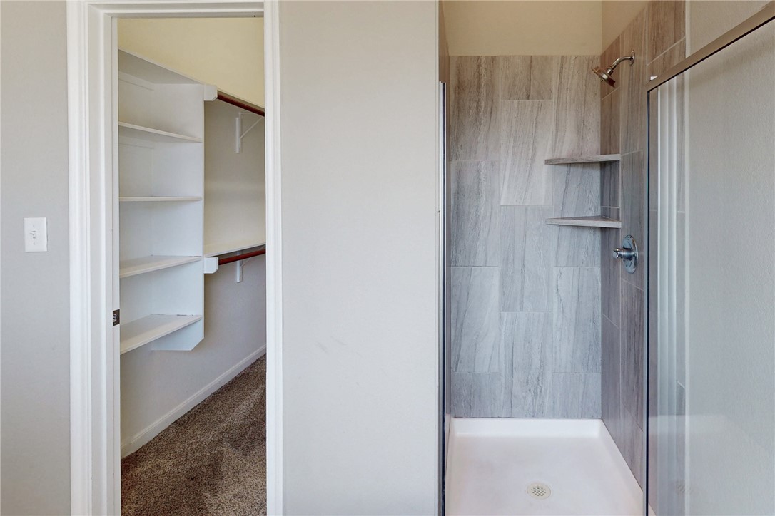 2043 Positano Loop Bryan, TX 77808 - Photo 10 of 22 Primary closet and shower