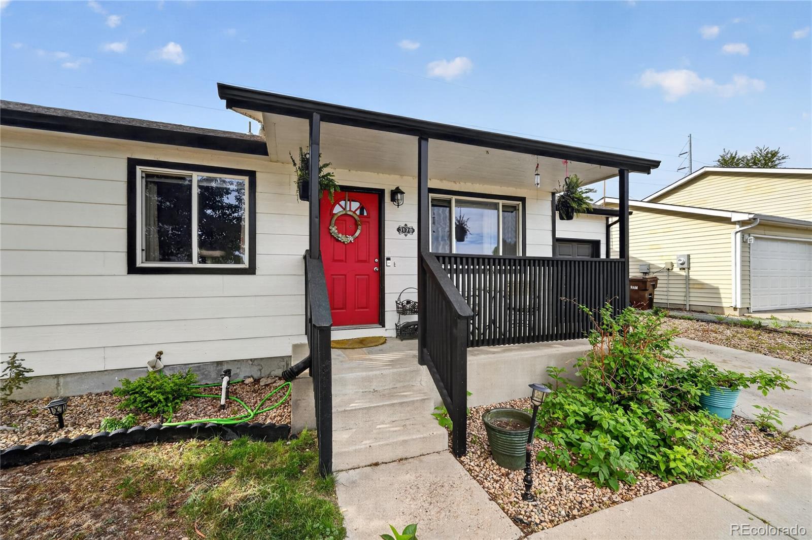 3170 West 3rd Street Road Greeley, CO 80631 - Photo 1 of 29 a front view of a house with a yard