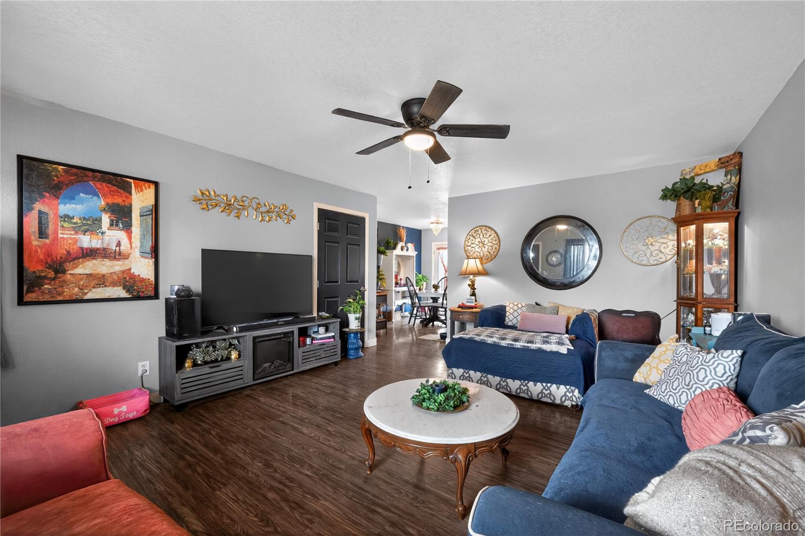 3170 West 3rd Street Road Greeley, CO 80631 - Photo 11 of 29 a living room with furniture and a flat screen tv