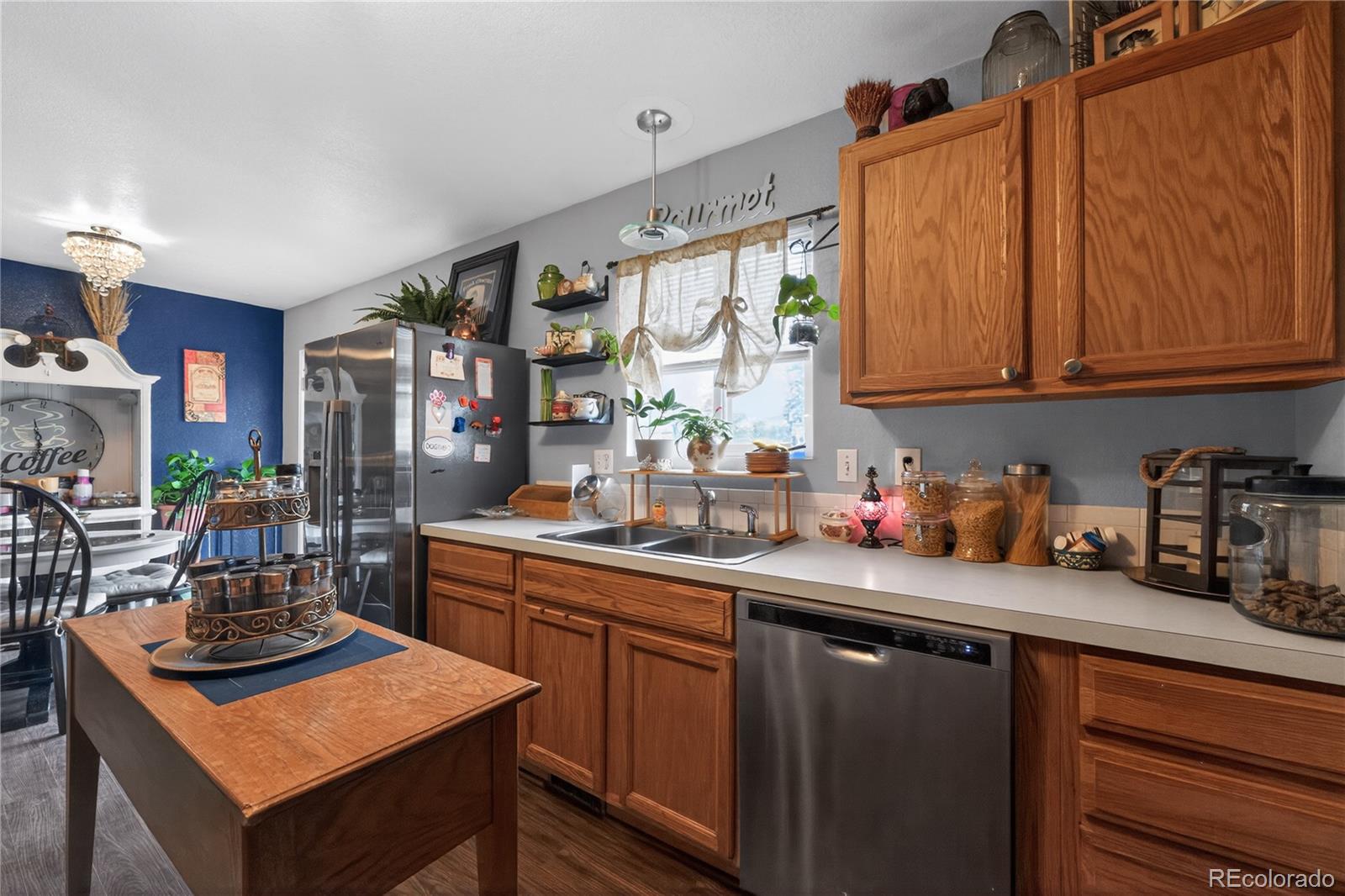 3170 West 3rd Street Road Greeley, CO 80631 - Photo 14 of 29 a kitchen with sink cabinets and stove