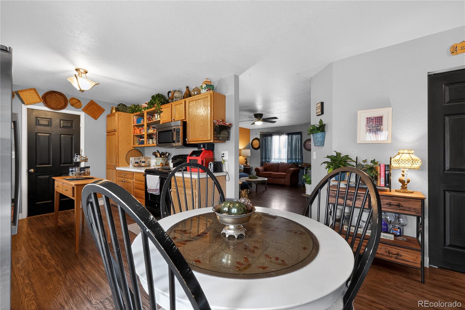 3170 West 3rd Street Road Greeley, CO 80631 - Photo 18 of 29 a dining room with furniture and wooden floor