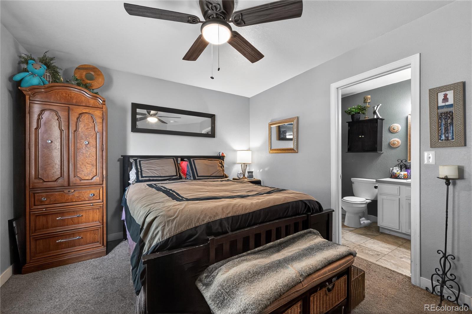 3170 West 3rd Street Road Greeley, CO 80631 - Photo 21 of 29 a bedroom with a bed and wooden floor