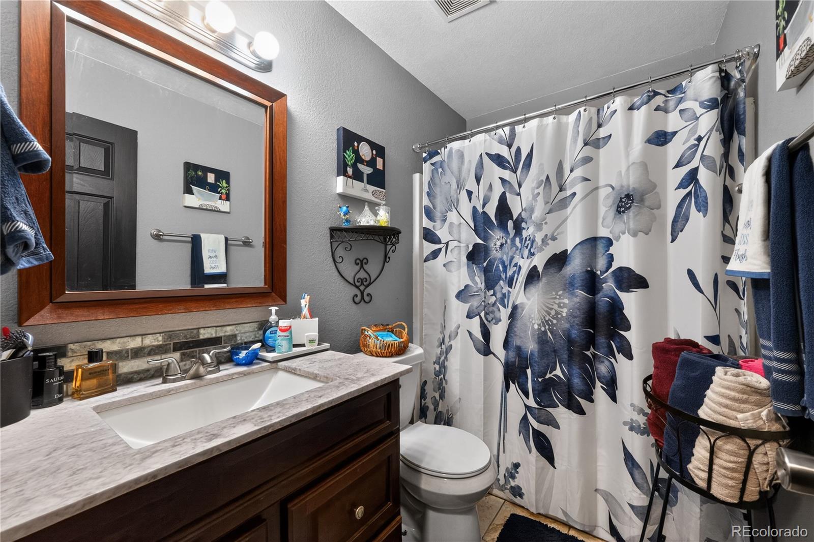 3170 West 3rd Street Road Greeley, CO 80631 - Photo 22 of 29 a bathroom with a granite countertop sink and a mirror