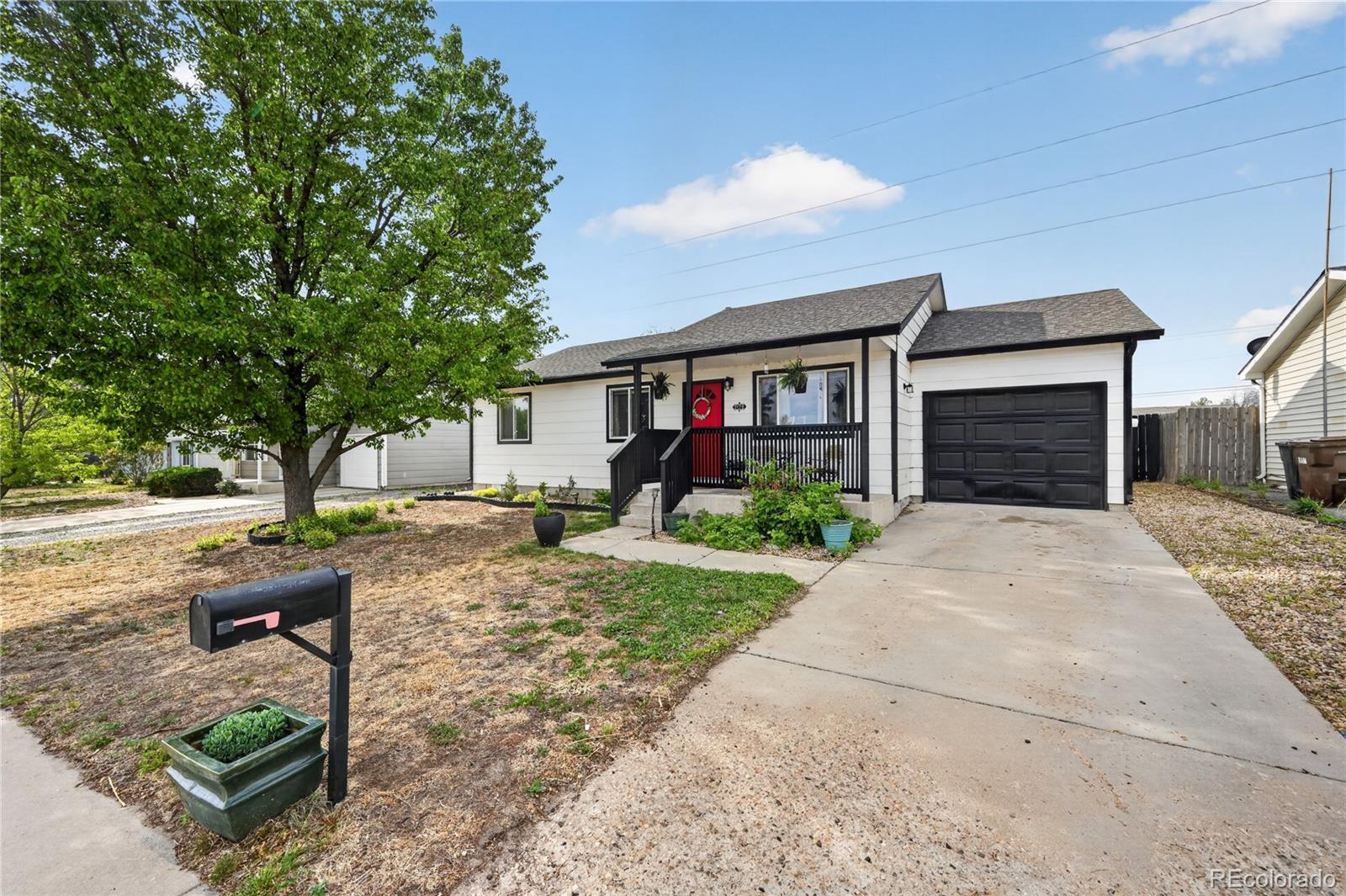3170 West 3rd Street Road Greeley, CO 80631 - Photo 5 of 29 a front view of a house with garden