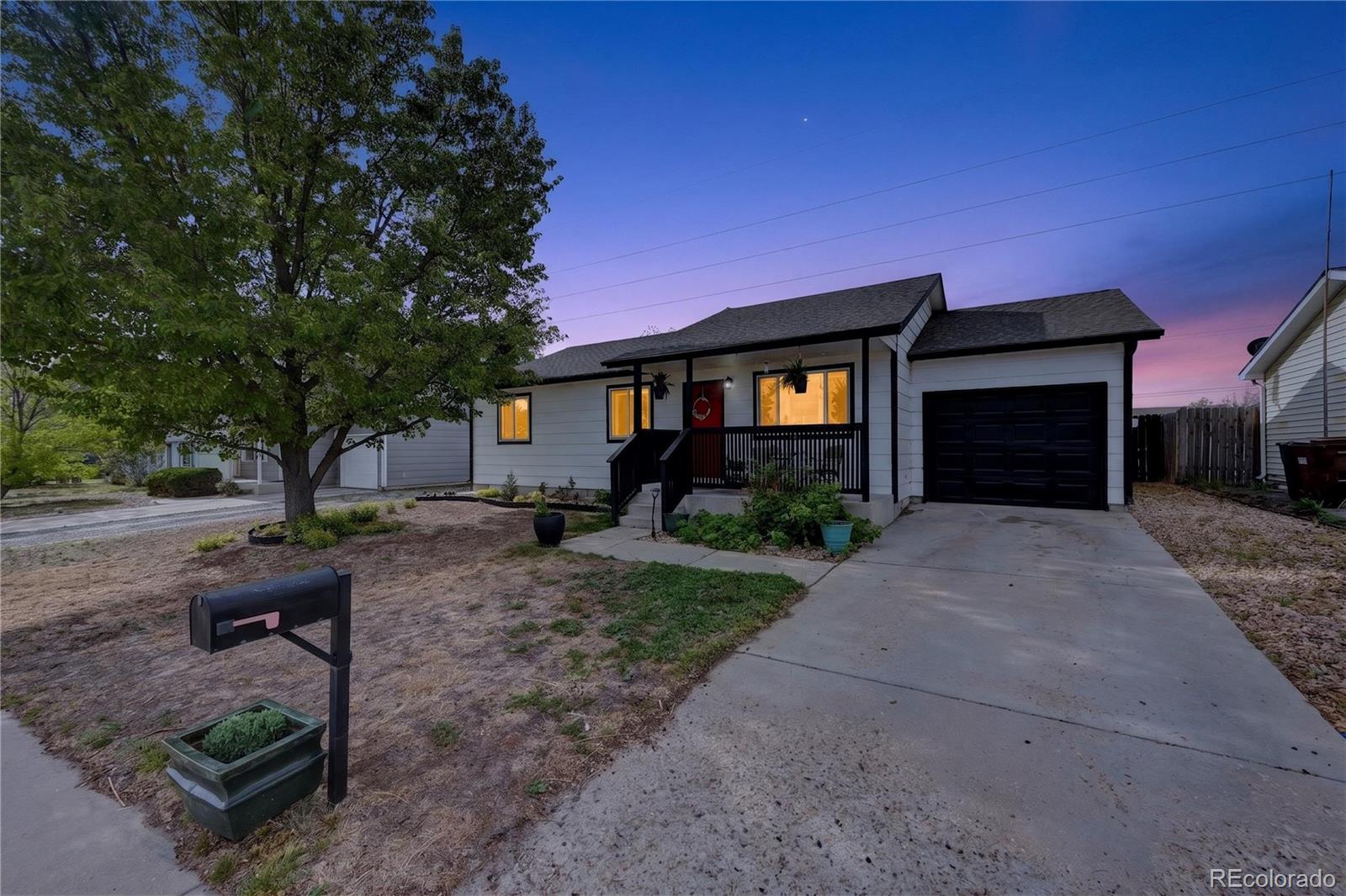 3170 West 3rd Street Road Greeley, CO 80631 - Photo 6 of 29 a front view of a house with garden