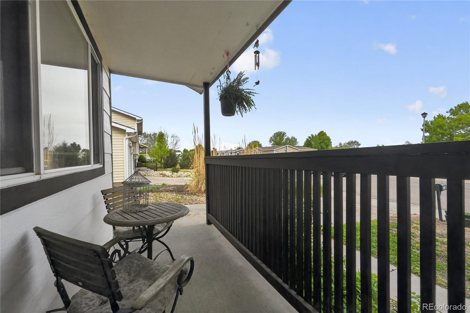3170 West 3rd Street Road Greeley, CO 80631 - Photo 8 of 29 a view of balcony with wooden floor and outdoor seating
