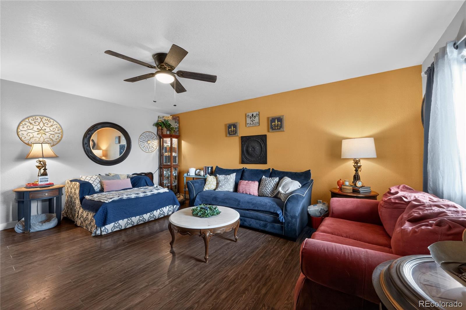 3170 West 3rd Street Road Greeley, CO 80631 - Photo 10 of 29 a living room with furniture a rug and a large window
