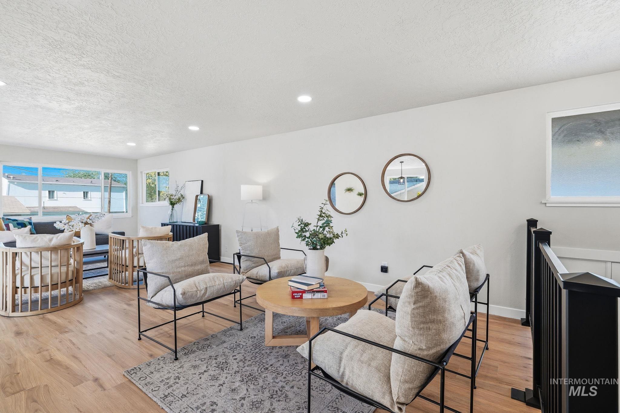 1990 Panama Street Boise, ID 83705 - Photo 7 of 50 Spacious living area featuring wood-finish flooring, recessed lighting, and expansive windows