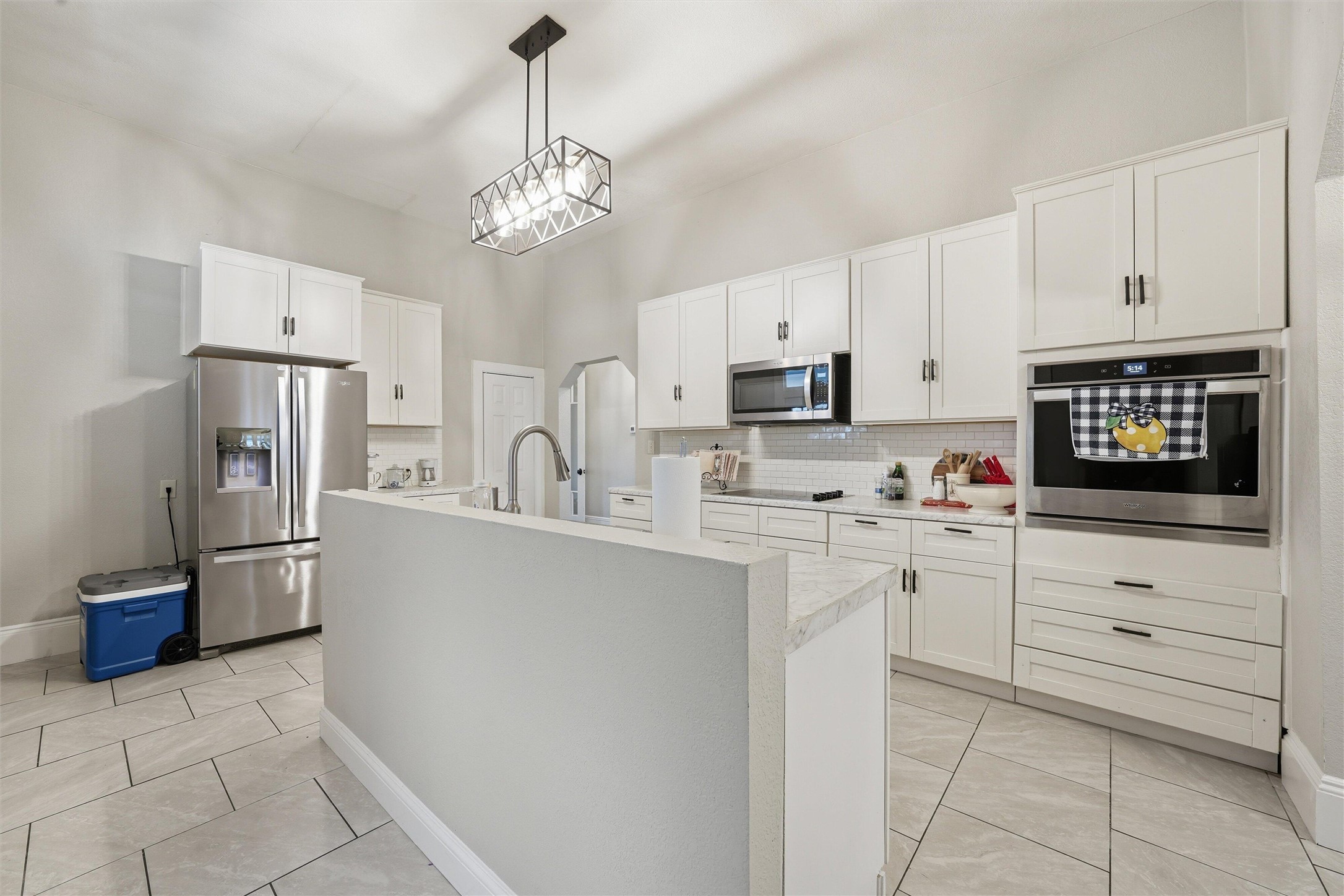 803 North 3rd Street Temple, TX 76501 - Photo 4 of 22 a kitchen with stainless steel appliances a refrigerator sink and cabinets
