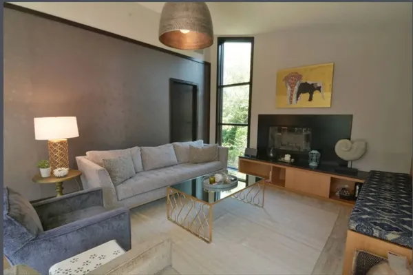 a living room with furniture and a window