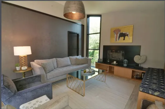 a living room with furniture and a window