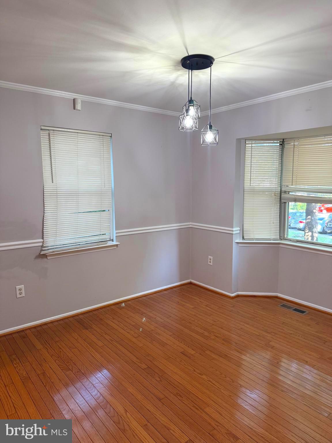 7028 Palamar Turn Lanham, MD 20706 - Photo 13 of 44 a view of an empty room with wooden floor and a window
