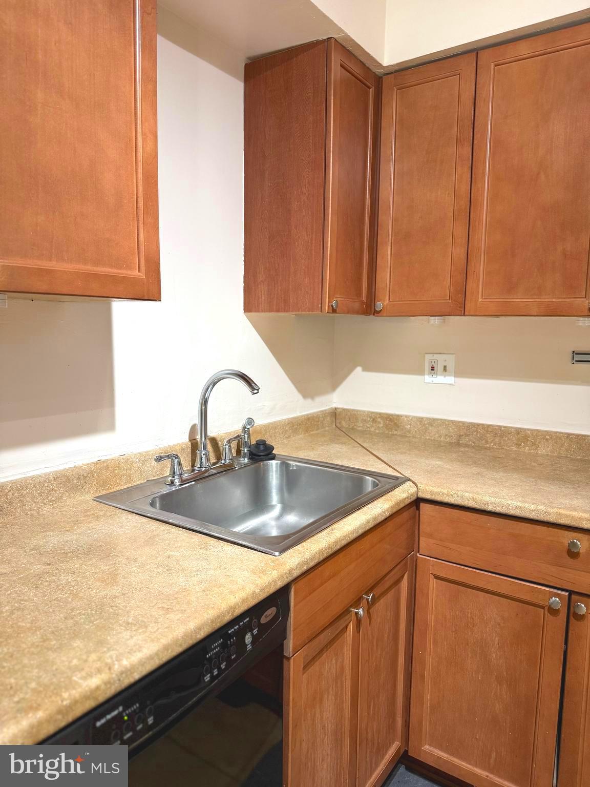 7028 Palamar Turn Lanham, MD 20706 - Photo 16 of 44 a kitchen with a sink and cabinets