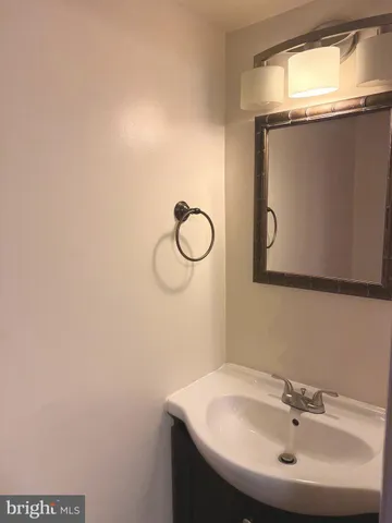 a bathroom with a sink and mirror