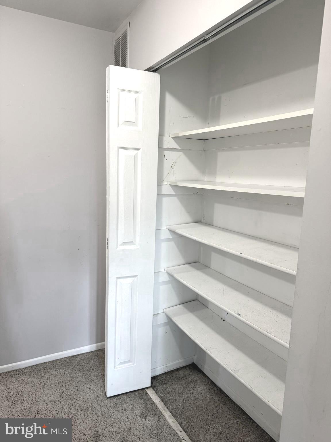 7028 Palamar Turn Lanham, MD 20706 - Photo 24 of 44 a view of an empty walk in closet