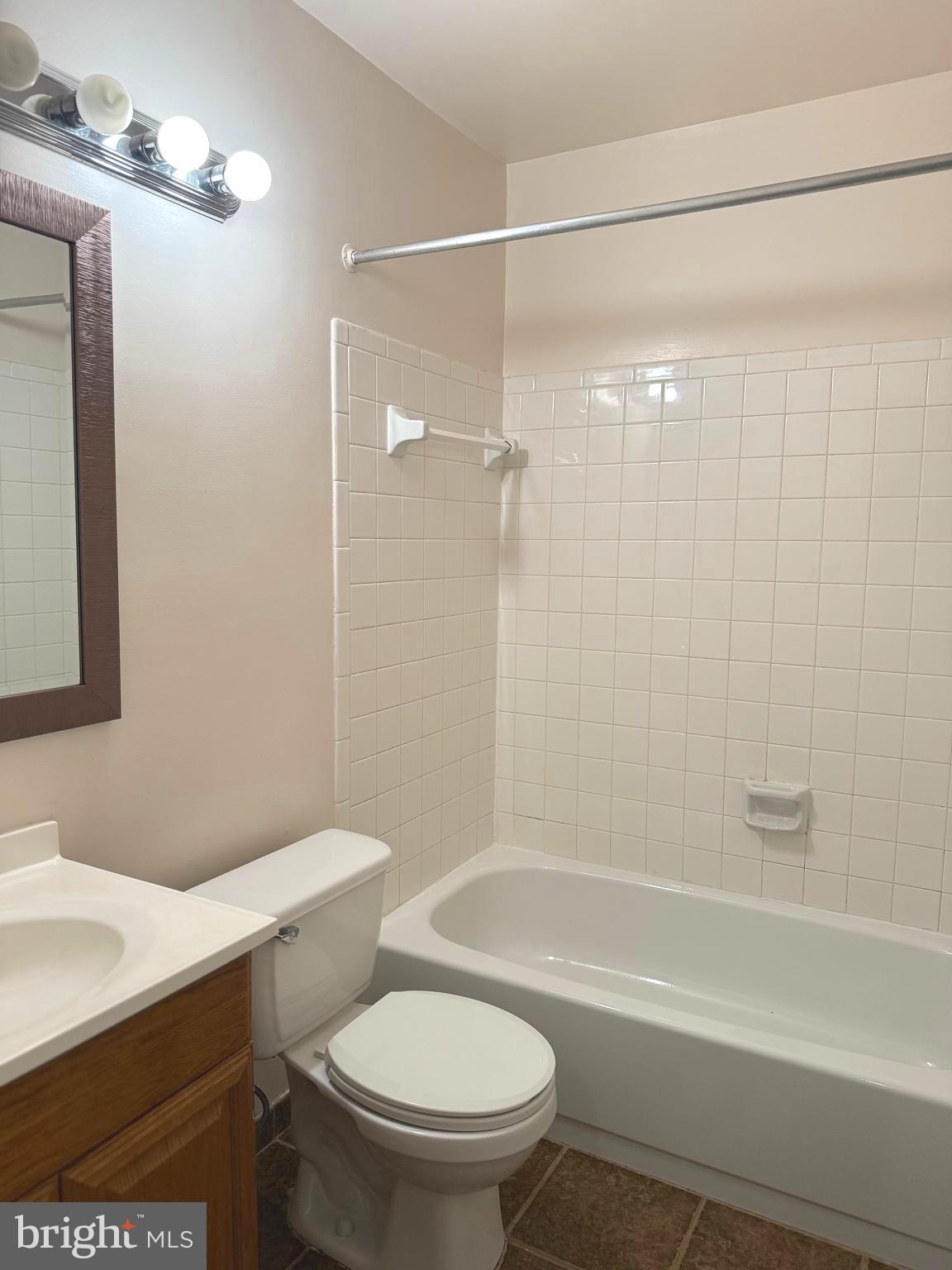 7028 Palamar Turn Lanham, MD 20706 - Photo 29 of 44 a bathroom with a sink a toilet and shower