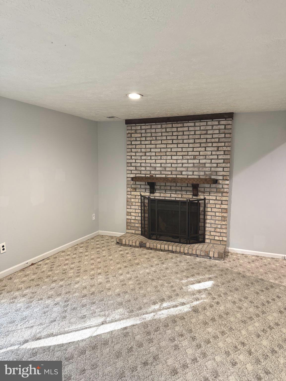 7028 Palamar Turn Lanham, MD 20706 - Photo 34 of 44 a view of empty room with a fireplace