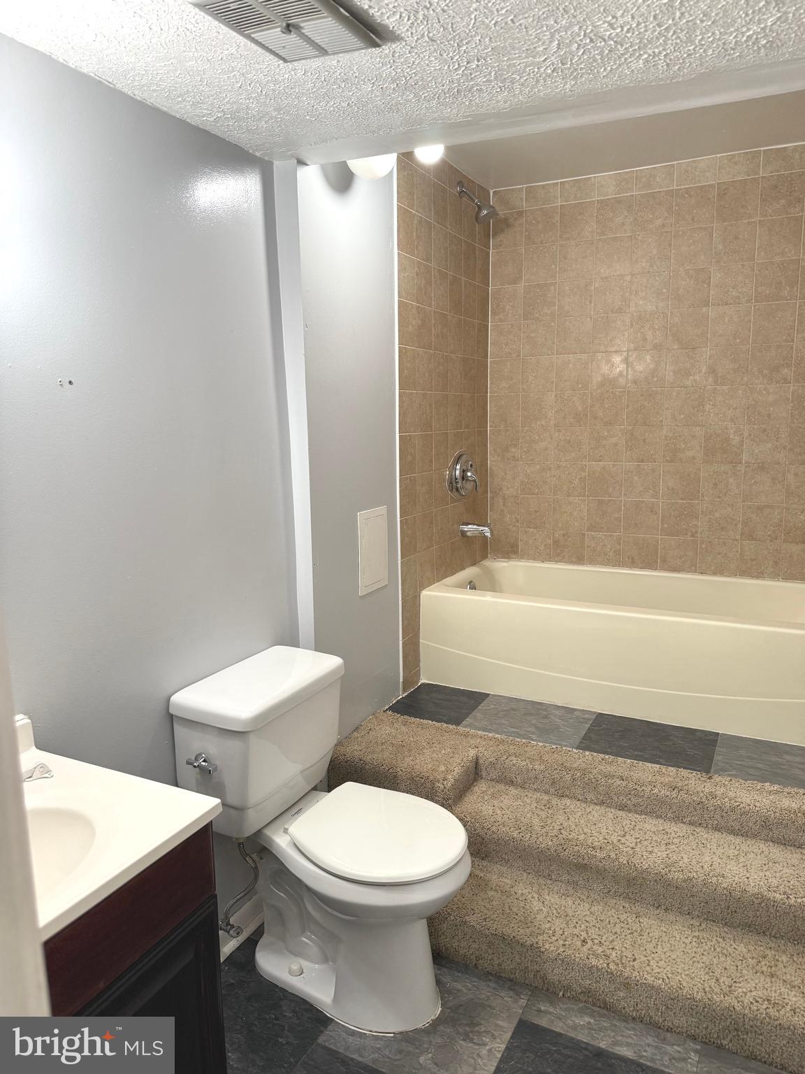 7028 Palamar Turn Lanham, MD 20706 - Photo 37 of 44 a bathroom with a toilet a sink and bathtub