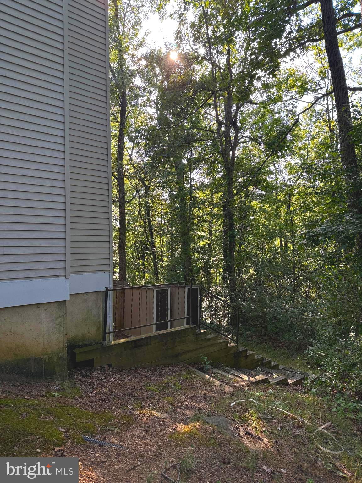 7028 Palamar Turn Lanham, MD 20706 - Photo 4 of 44 a wooden house with large trees and outdoor space