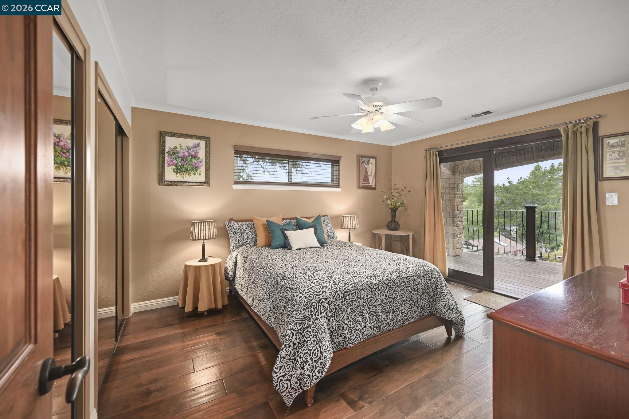 321 Livorna Heights Road Alamo, CA 94507 - Photo 21 of 60 a bedroom with a large bed and a chandelier