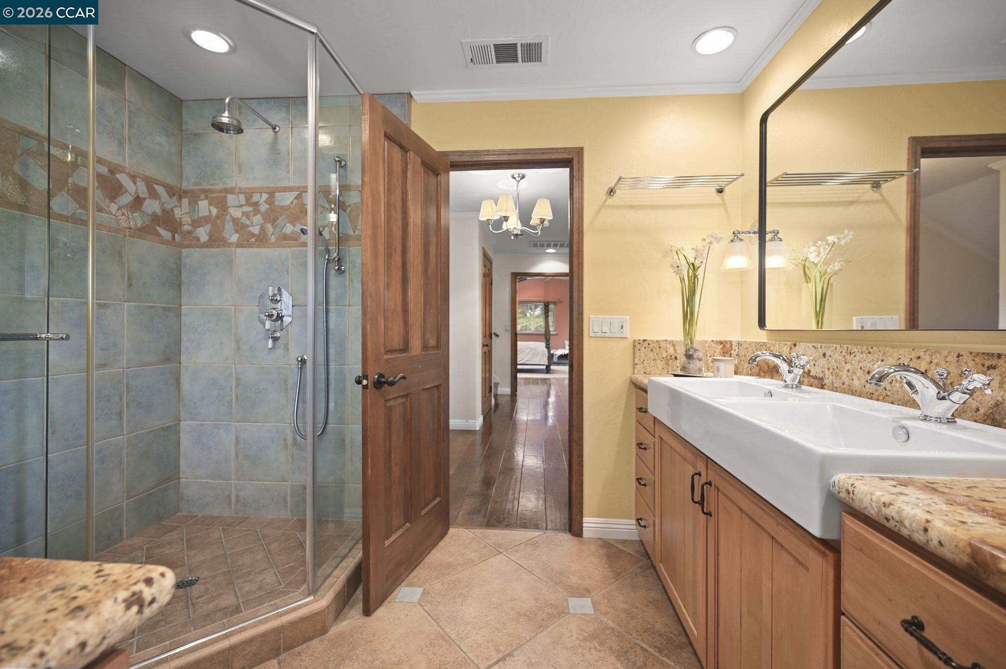 321 Livorna Heights Road Alamo, CA 94507 - Photo 24 of 60 a bathroom with a sink a shower and a mirror