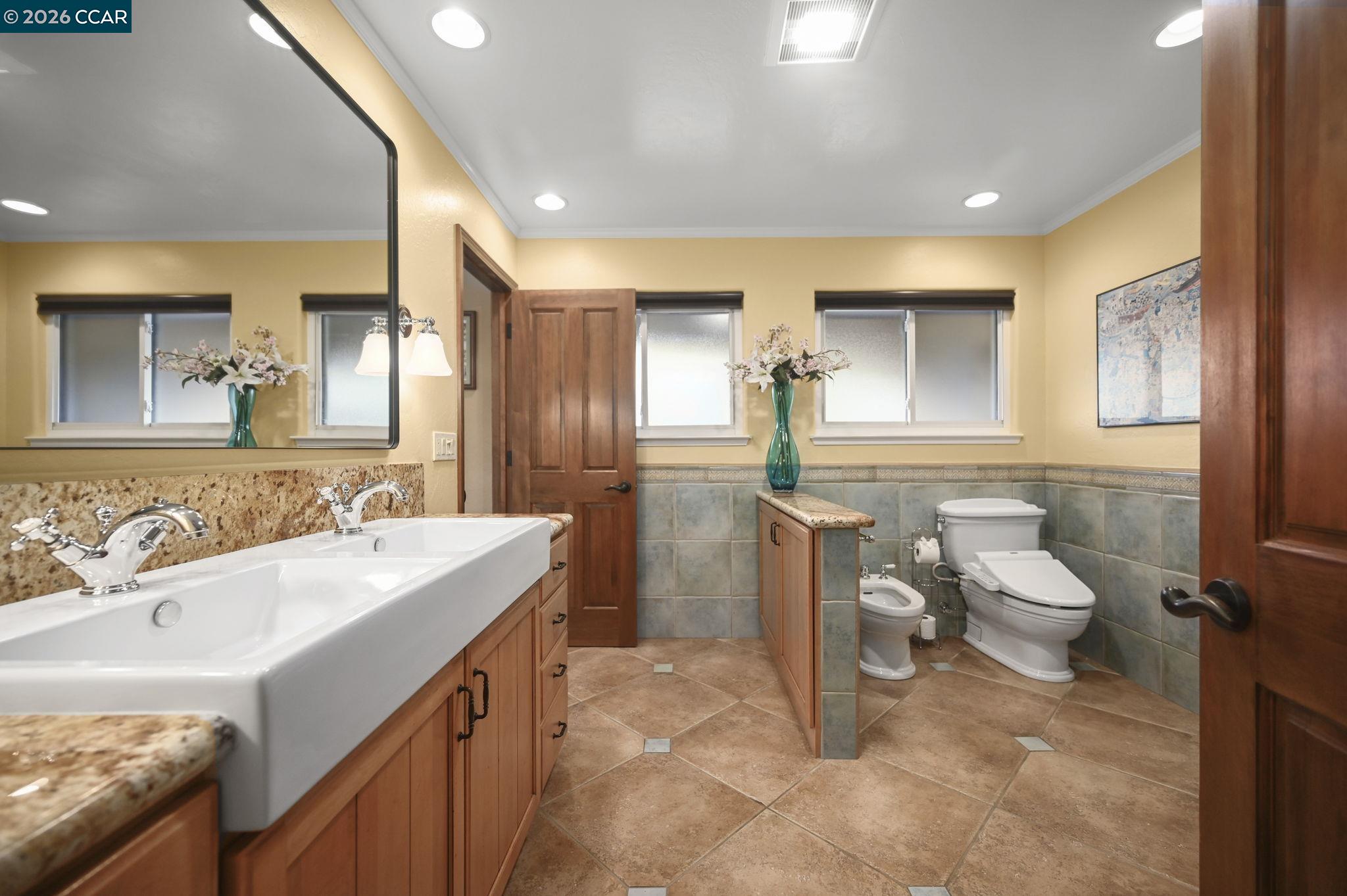 321 Livorna Heights Road Alamo, CA 94507 - Photo 25 of 60 a bathroom with a sink mirror and a toilet
