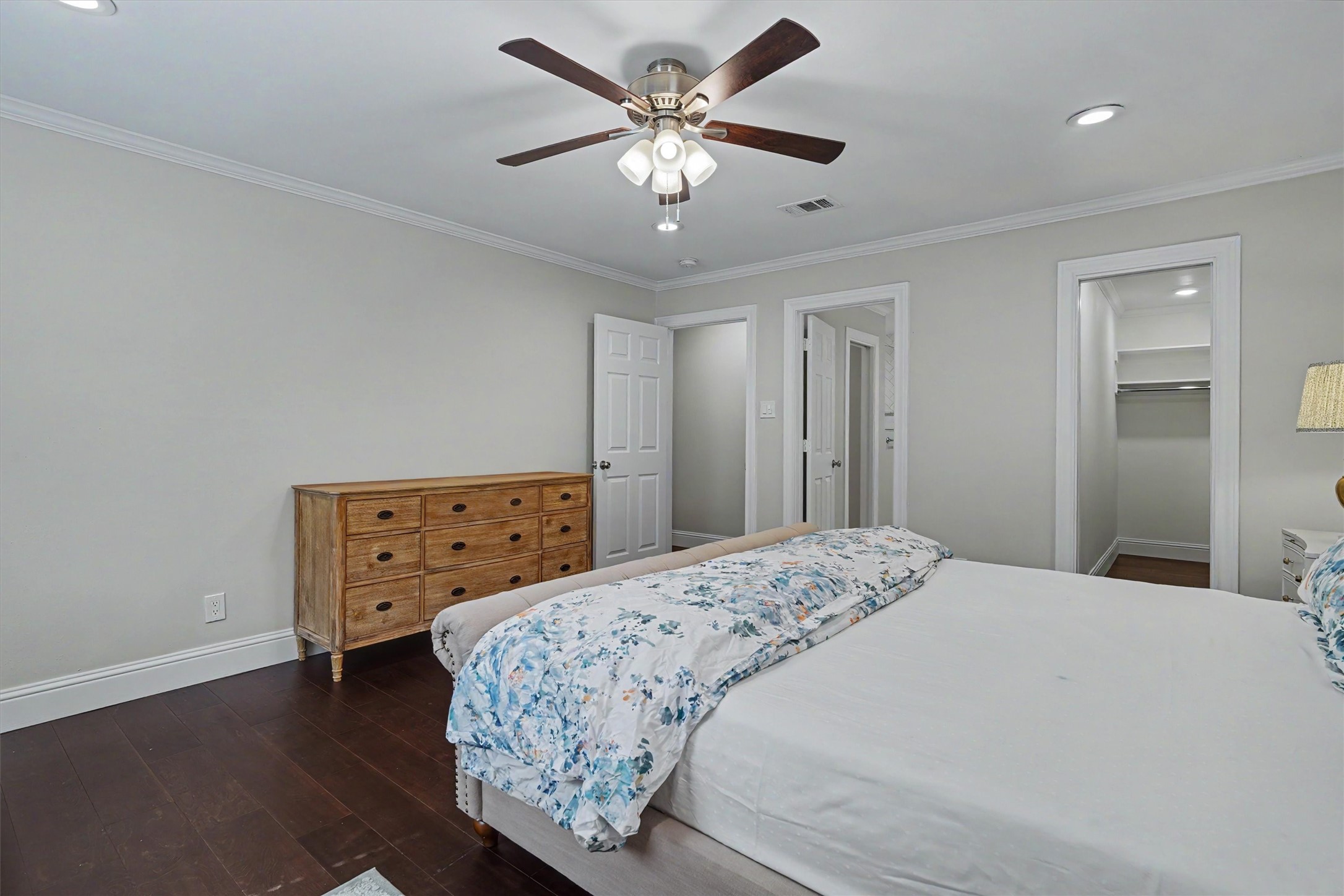 751 Bison Drive Houston, TX 77079 - Photo 19 of 45 a bedroom with a bed and a chandelier