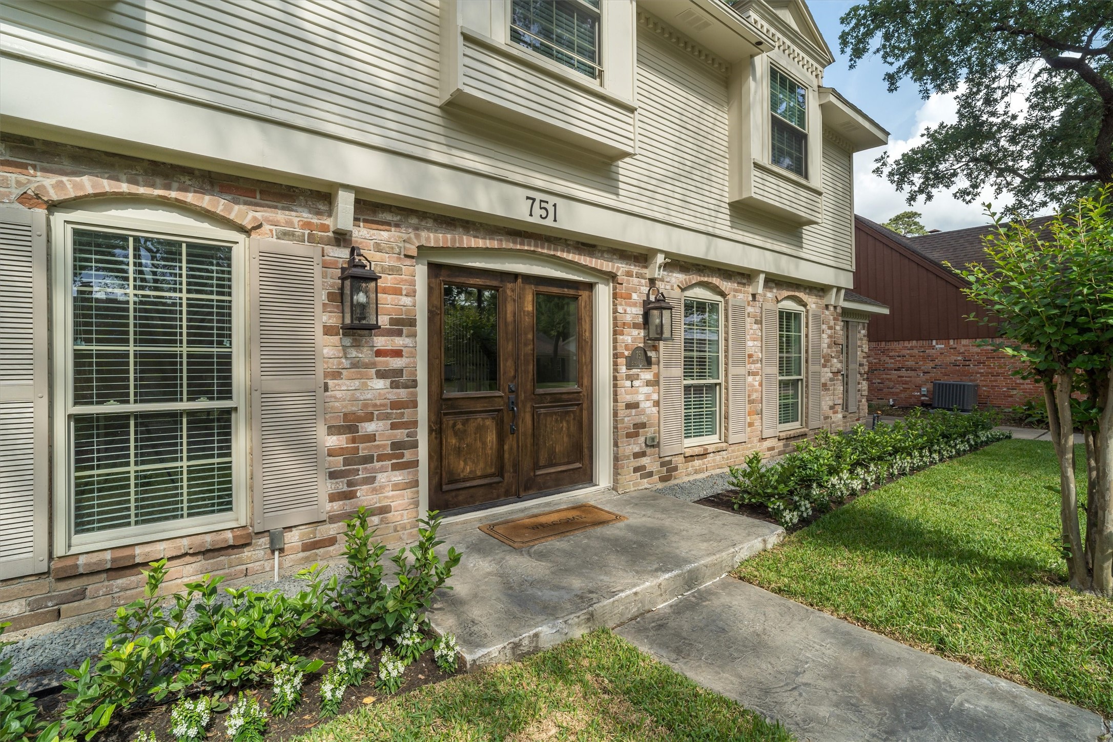 751 Bison Drive Houston, TX 77079 - Photo 2 of 45 a couple of potted plants in front of a house
