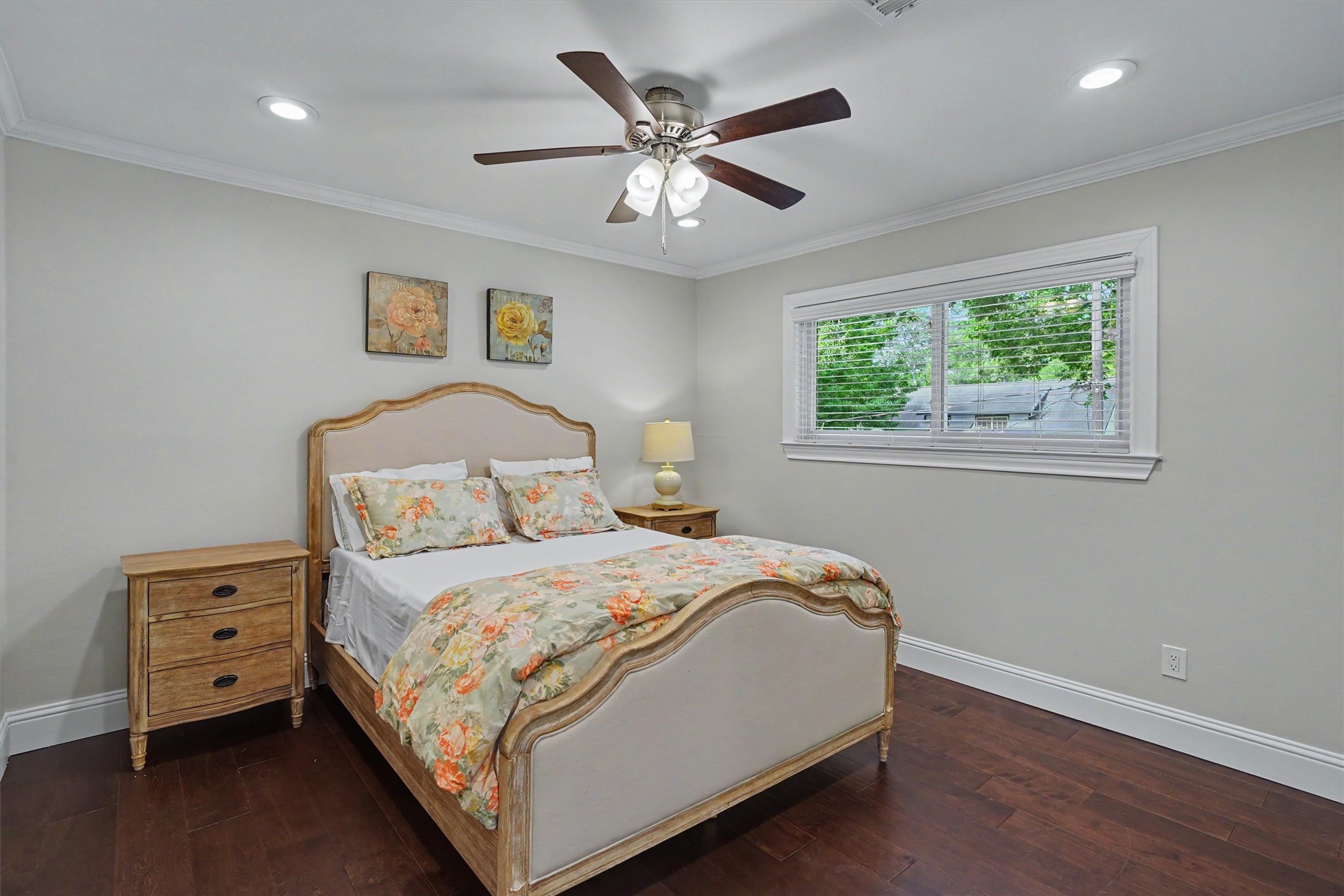 751 Bison Drive Houston, TX 77079 - Photo 23 of 45 a bedroom with a bed and a chandelier