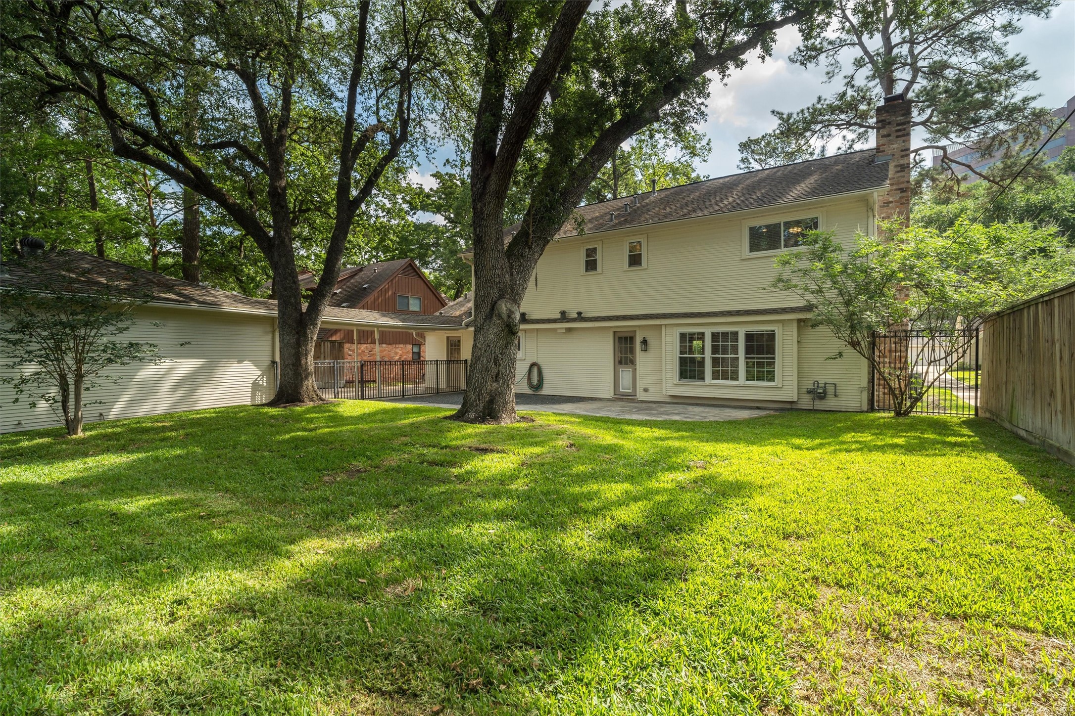 751 Bison Drive Houston, TX 77079 - Photo 29 of 45 a front view of a house with a yard