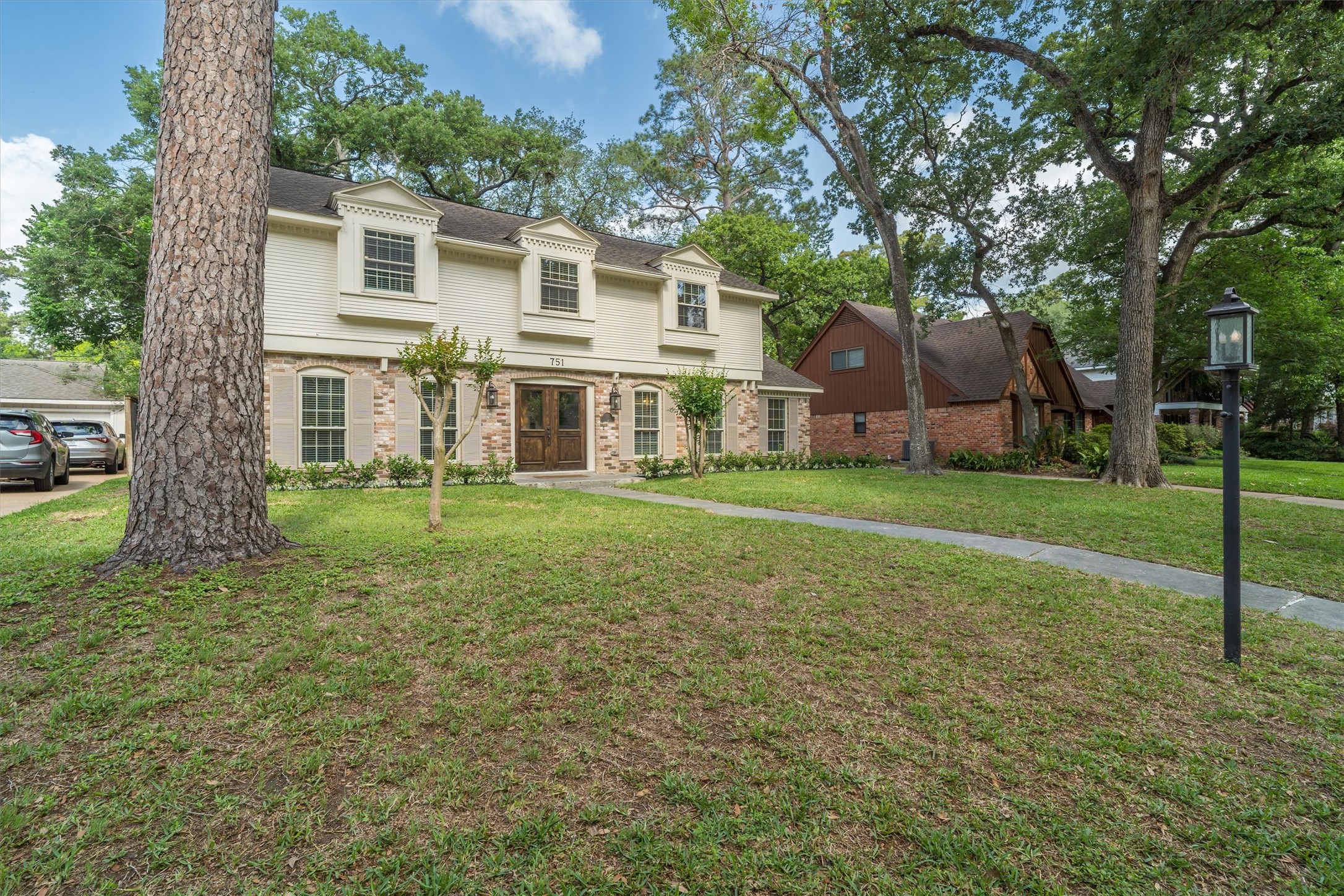 751 Bison Drive Houston, TX 77079 - Photo 35 of 45 a view of a house with a yard
