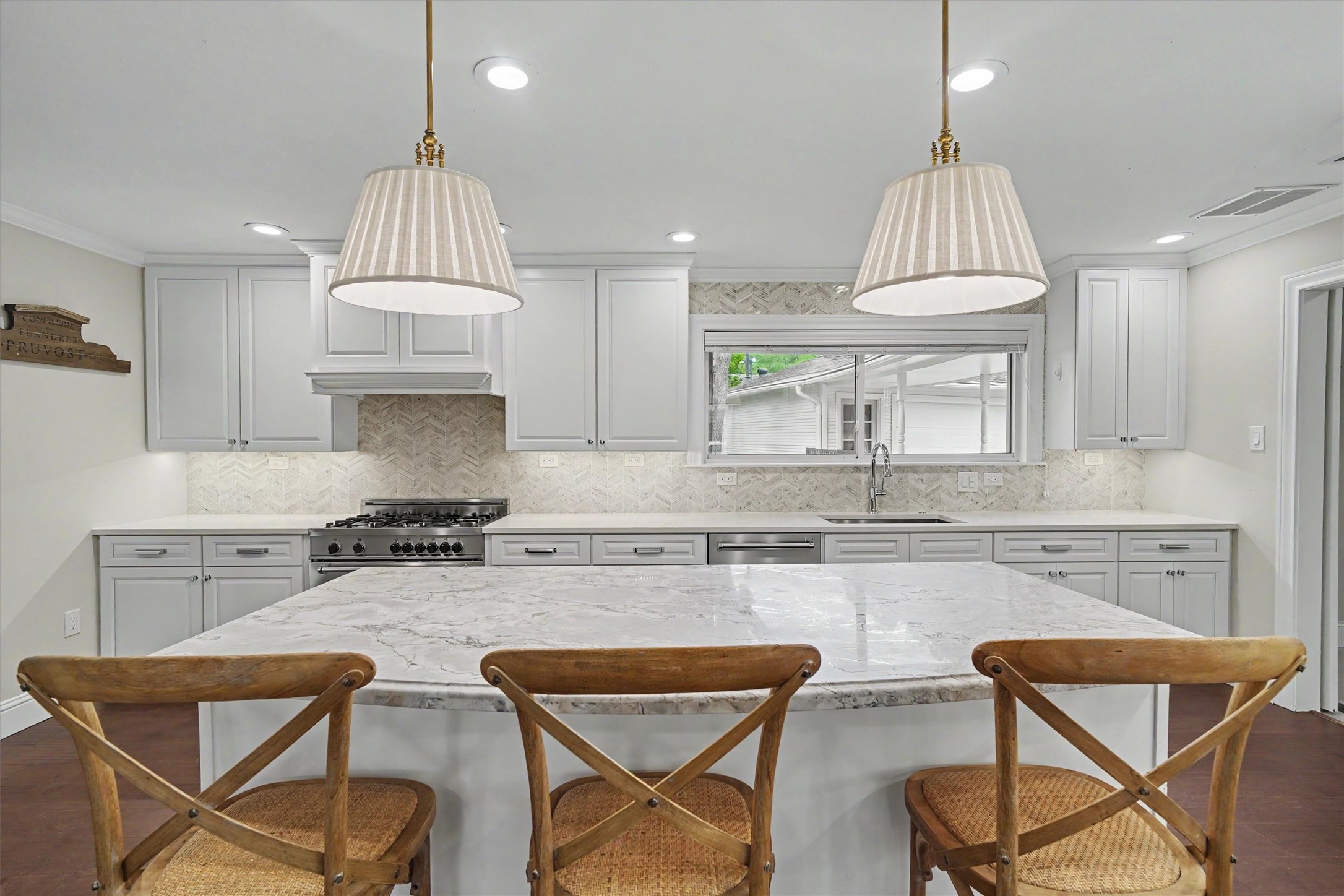 751 Bison Drive Houston, TX 77079 - Photo 4 of 45 a kitchen with stainless steel appliances granite countertop a sink a stove a dining table and chairs with wooden floor