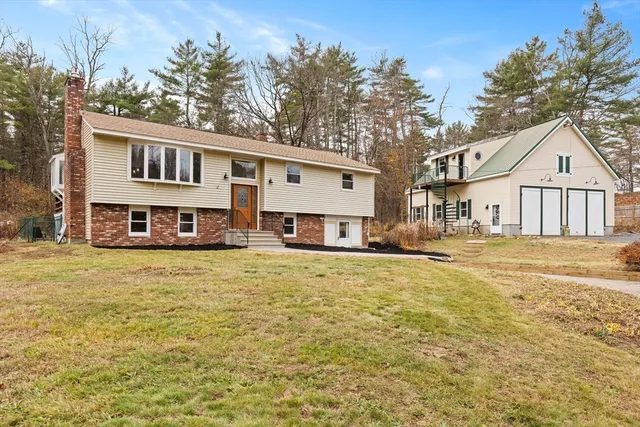 a front view of a house with swimming pool and porch