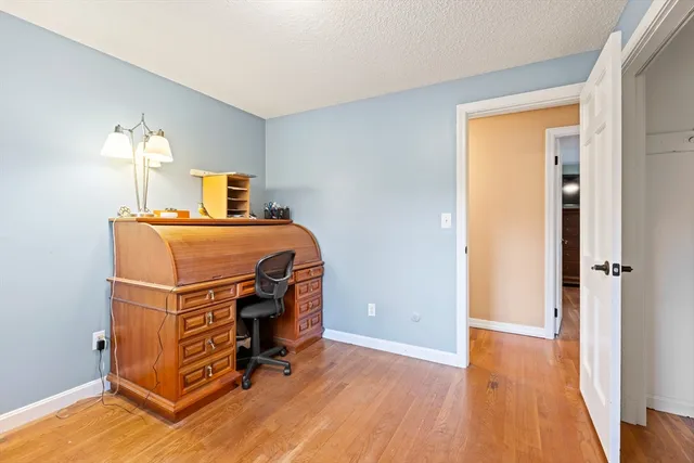 a bed room with a bed and a window