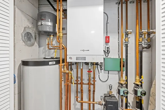 a bathroom with a sink mirror vanity and toilet