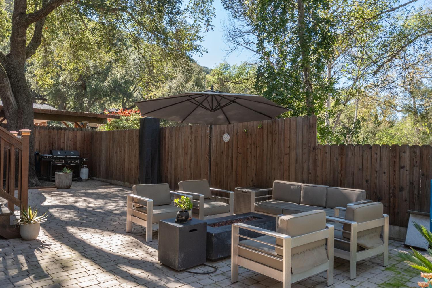 15663 Ojai Road Santa Paula, CA 93060 - Photo 40 of 47 a view of backyard with outdoor seating and trees