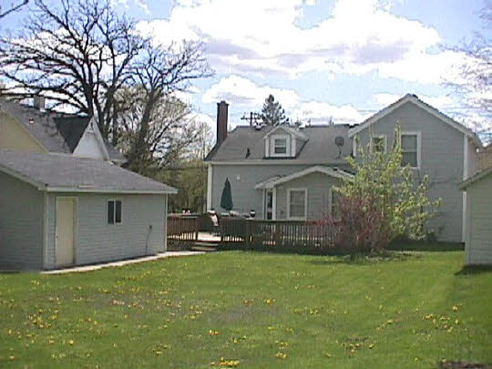 1920 Main St Road Spring Grove, IL 60081 - Photo 2 of 5 a front view of a house with a garden