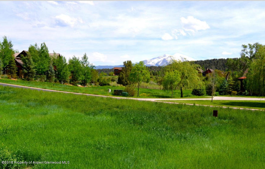 375 River's Bend Carbondale, CO 81623 - Photo 3 of 8 a view of a golf course with a lake