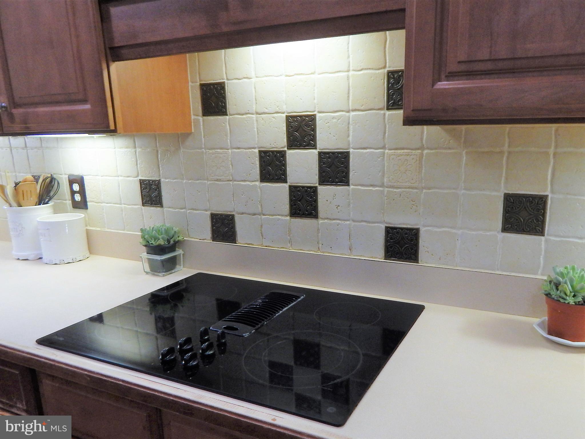 31263 Point Lookout Road Mechanicsville, MD 20659 - Photo 43 of 43 stove top/ceramic tile backsplash