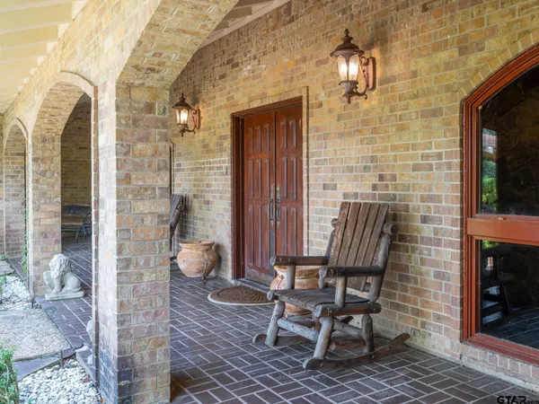 a view of a door with chair and fire pit