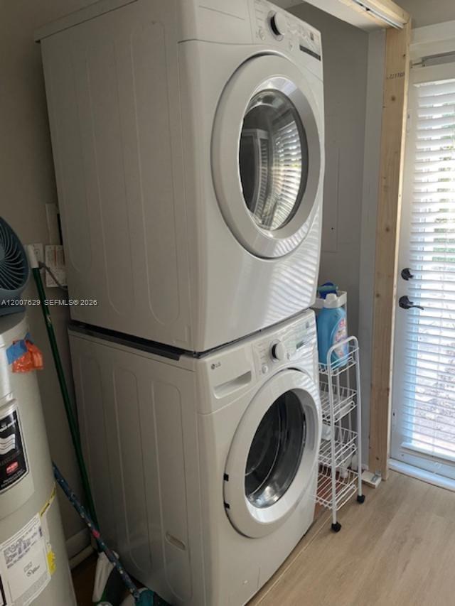 5886 Southwest 42nd Street Miami, FL 33155 - Photo 14 of 20 a view of a hallway with washer and dryer