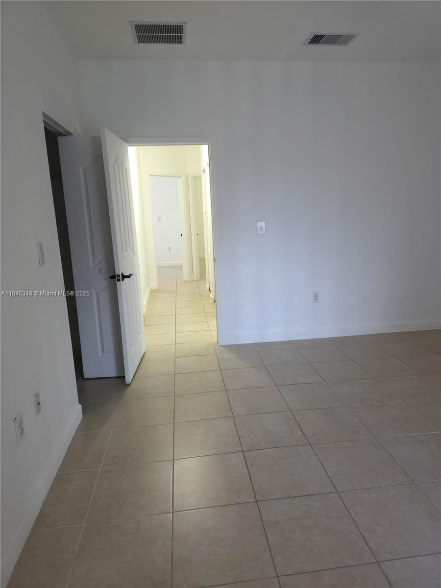 11357 Southwest 230th Terrace Miami, FL 33170 - Photo 15 of 24 a view of an empty room with a window