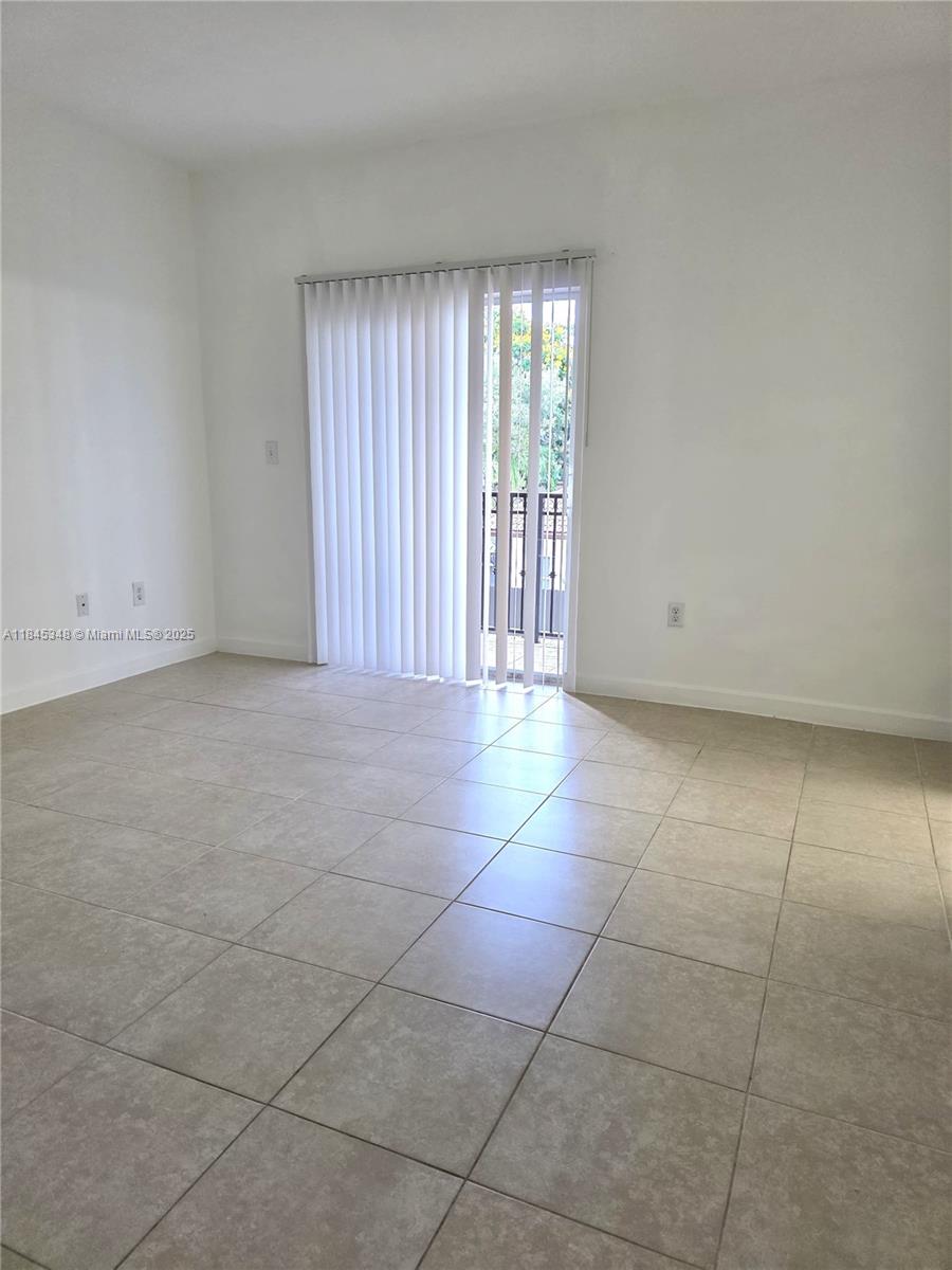 11357 Southwest 230th Terrace Miami, FL 33170 - Photo 16 of 24 a view of an empty room with a window
