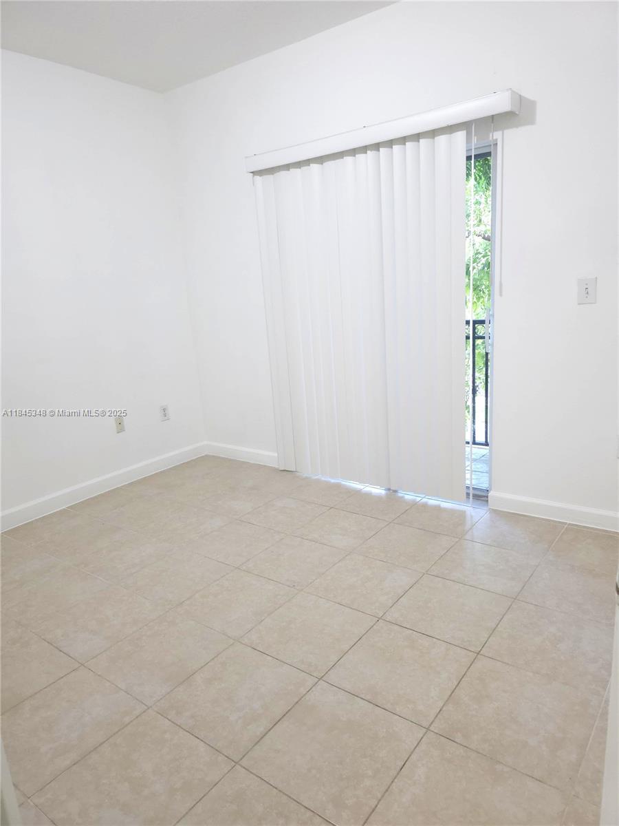11357 Southwest 230th Terrace Miami, FL 33170 - Photo 20 of 24 an empty room with an entryway