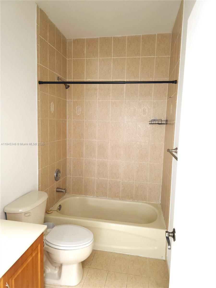 11357 Southwest 230th Terrace Miami, FL 33170 - Photo 21 of 24 a bathroom with a toilet and a shower