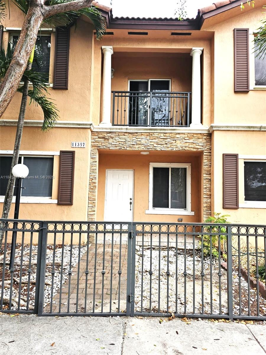 11357 Southwest 230th Terrace Miami, FL 33170 - Photo 4 of 24 front view of a building