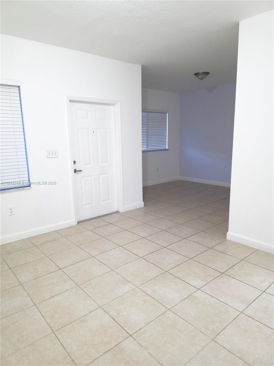 11357 Southwest 230th Terrace Miami, FL 33170 - Photo 10 of 24 a view of an empty room