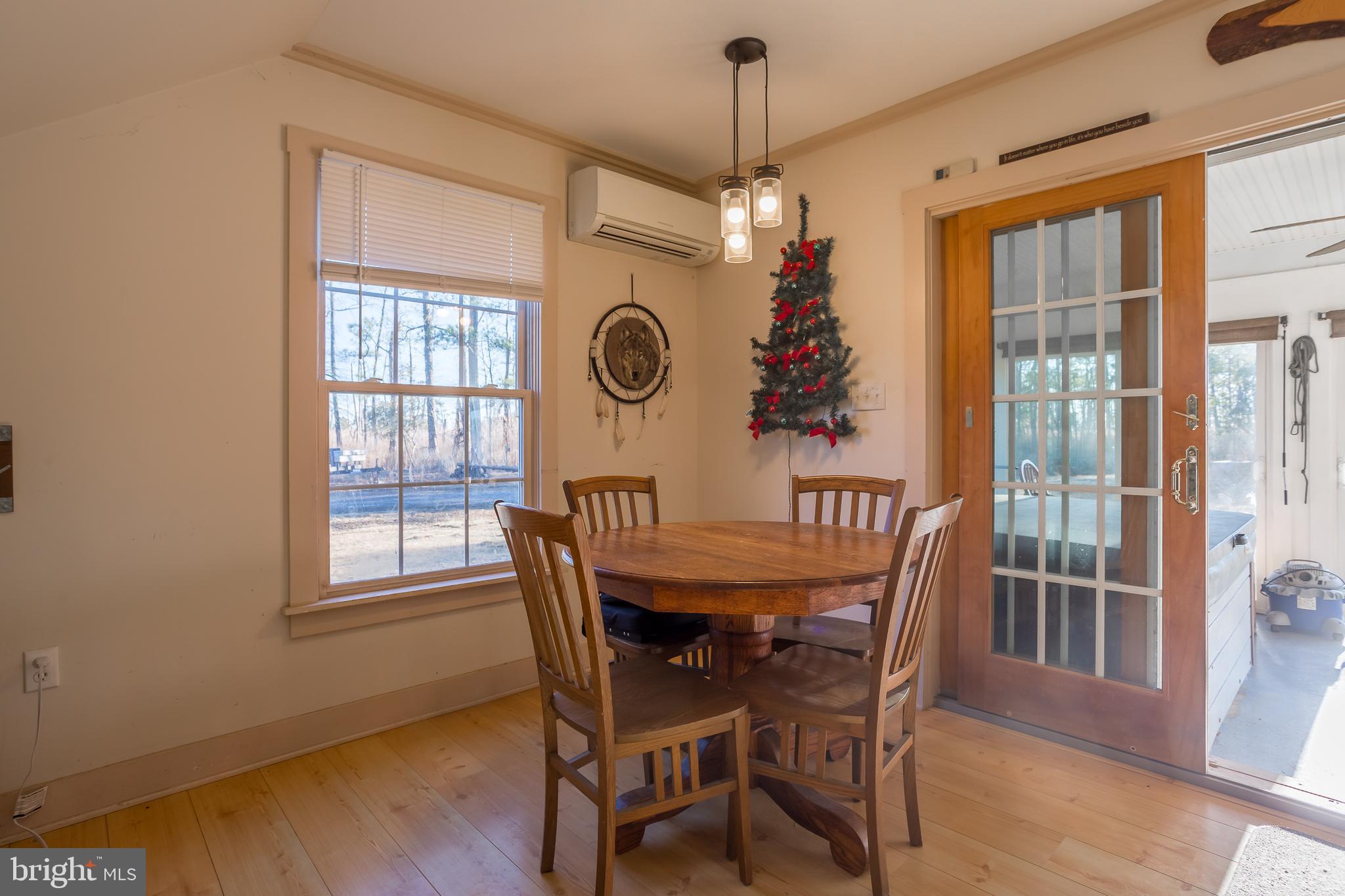 3819 Maple Dam Road Cambridge, MD 21613 - Photo 14 of 79 a view of a dining room with furniture window and wooden floor