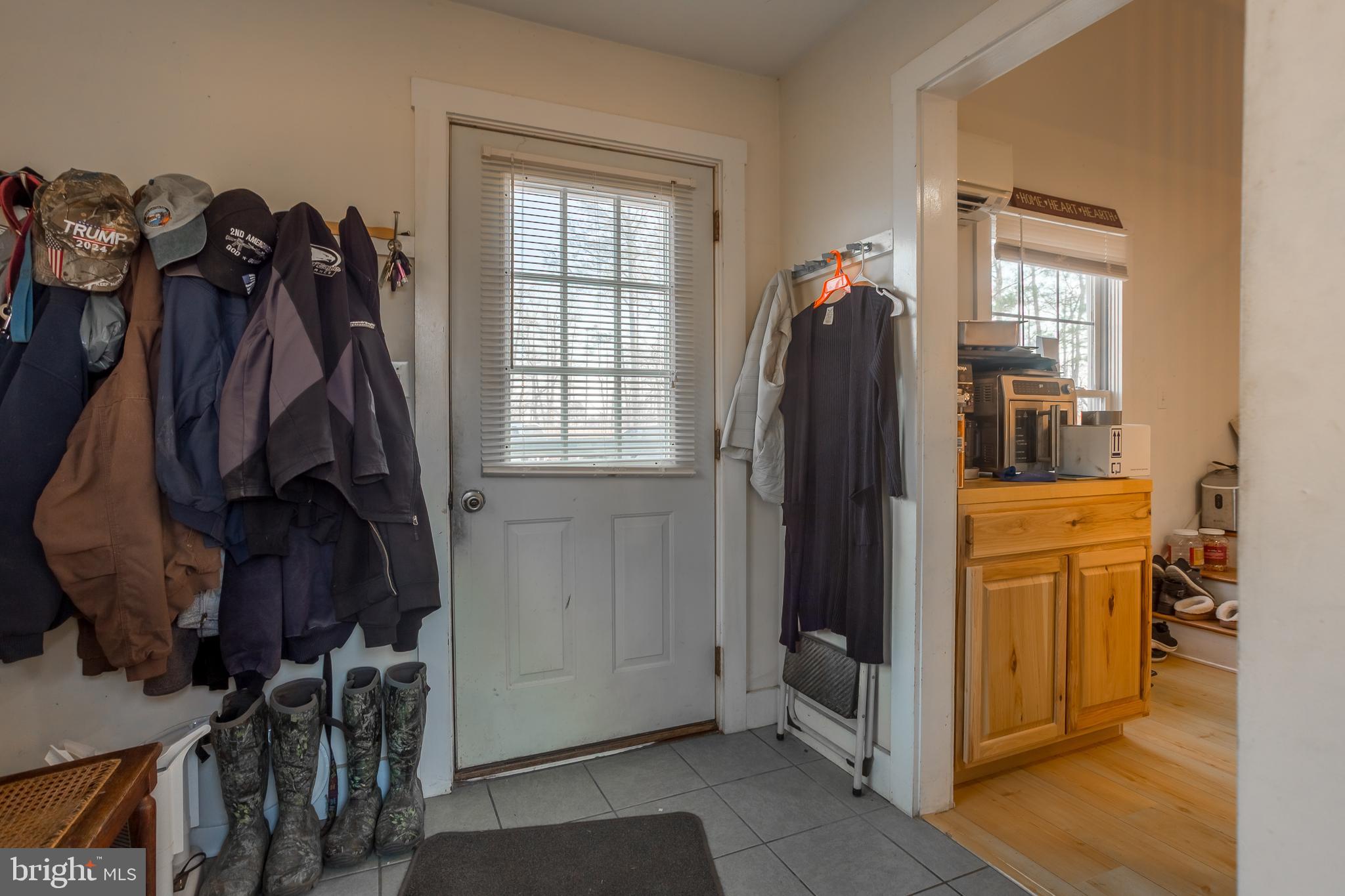 3819 Maple Dam Road Cambridge, MD 21613 - Photo 18 of 79 a view of walk in closet with clothes and shoes